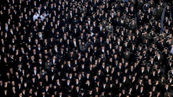 Ultra-Orthodox Jewish men in Jerusalem protest a Supreme Court ruling that they cannot be exempt from military service in June, 2024