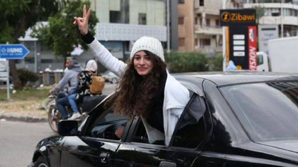 Displaced residents celebrate as they return to their villages following a ceasefire between Israel and Hezbollah that went into effect on Wednesday, Nov. 27, 2024