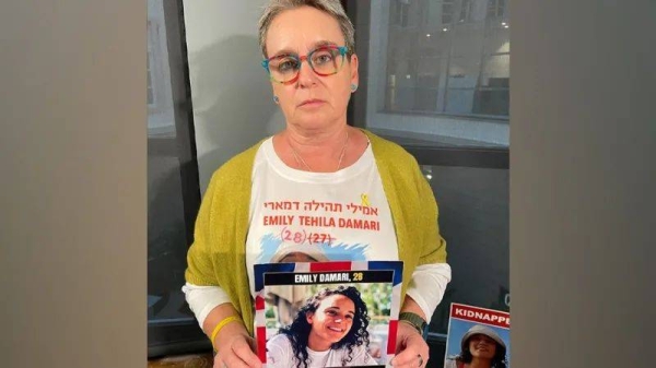 Family handout showing Emily Damari wearing a Tottenham Hotspur scarf at a football match