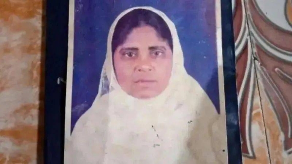 A passport photo of Hamida Banu, wearing a white scarf. She said she was happy to be back with her children and siblings