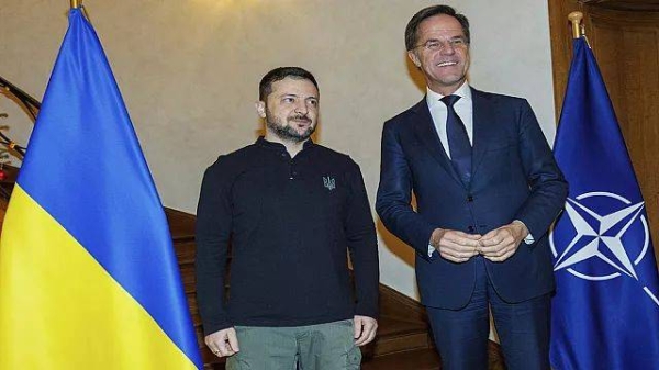 NATO Secretary General Mark Rutte, right, greets Ukraine's President Volodymyr Zelensky prior to a meeting in Brussels on Wednesday, Dec. 18, 2024.