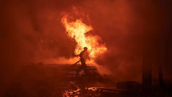 Ukrainian first responders work at the site of a Russian missile assault on the city center of Kyiv, Ukraine, on December 20, 2024