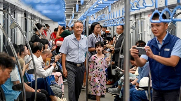 Passengers are seen on a train of the Line 1 of the HCMC Metro in Ho Chi Minh City on December 22, 2024