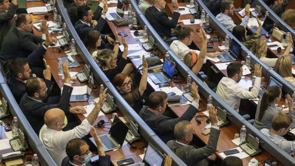 Kosovo lawmakers vote during the parliament session in Pristina, 7 July 2021