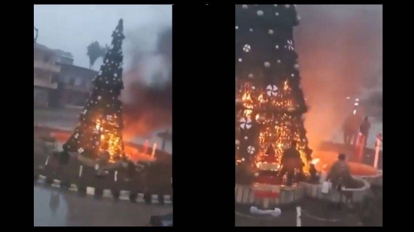 On Monday night, video captured masked gunmen setting a Christmas tree on fire