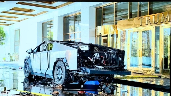 The remains of a black-tarp covered Tesla Cybertruck that burned at the entrance of Trump Tower, in Las Vegas