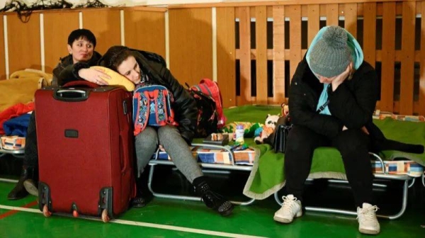 People resting at a refugee shelter in Ubla, Slovakia, in February 2022 after Russia launched its war against Ukraine