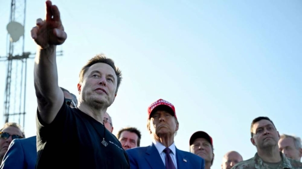 President-elect Donald Trump listens to Elon Musk at the launch of the sixth test flight of the SpaceX Starship rocket Tuesday, Nov. 19, 2024 in Boca Chica, Texas