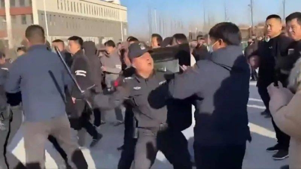 In one verified video, a policeman is seen beating a protester with a baton