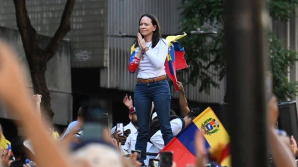 Venezuelan opposition leader Maria Corina Machado gestures during a protest in Caracas on the eve of Maduro's inauguration