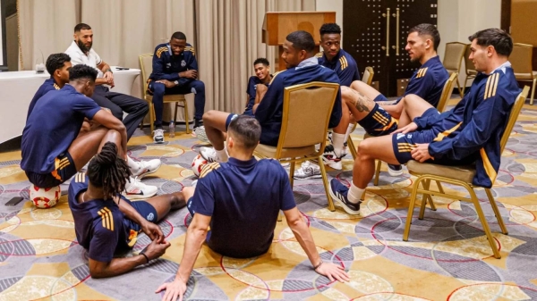 Benzema seen surrounded by Real Madrid players, with younger stars in particular showing admiration for the legendary striker.