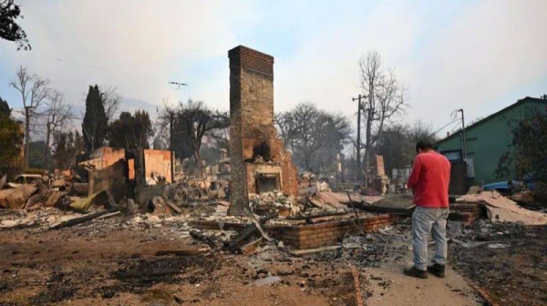 A home in Altadena is reduced to its chimney after being destroyed by the Eaton fire