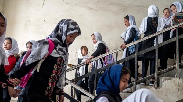 Girls attend school on the first day of the new school year, in Kabul, Afghanistan, on Saturday, March 25, 2023