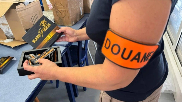 A French customs official pictured with seized aphrodisiac honey products