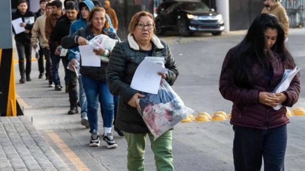 Deportees seen at the US-Mexico border in Tijuana on 21 January