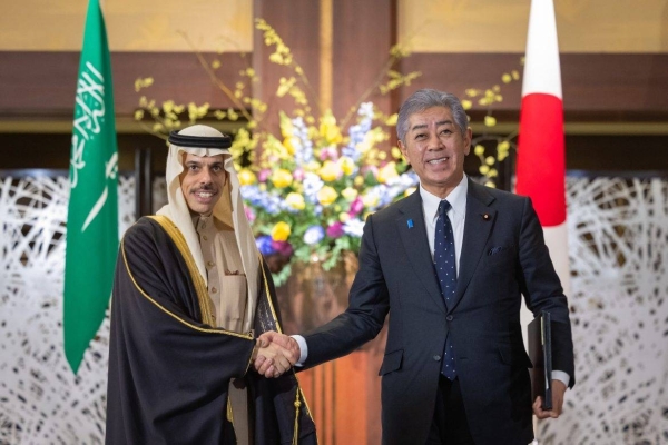 Japanese Foreign Minister Iwaya Takeshi receives Saudi Minister of Foreign Affairs Prince Faisal bin Farhan in Tokyo on Monday.
