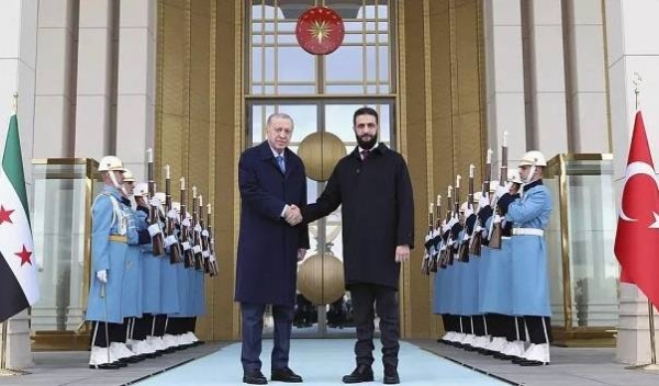 Turkish President Recep Tayyip Erdogan greets Syria's interim President Ahmad al-Sharaa ahead of meeting in presidential palace in Ankara, Turkey, Tuesday, Feb. 4, 2025