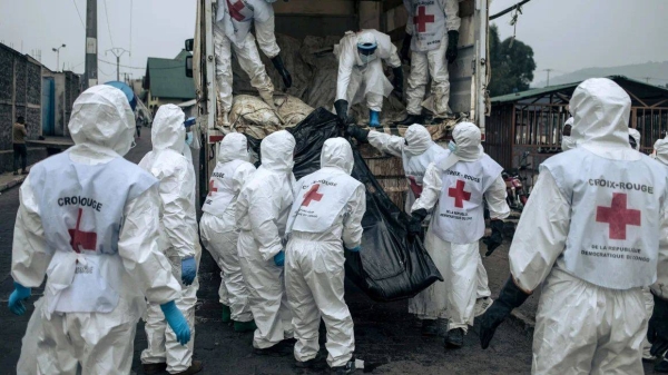 Members of the Congolese Red Cross and Civil Protection unload the bodies of the victims of the recent clashes in Goma for burial, on February 3, 2025