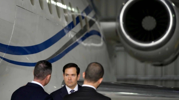 Secretary of State Marco Rubio stands by the Venezuelan government airplane he announced is being seized during a press conference in the Dominican Republic, on February 6, 2025