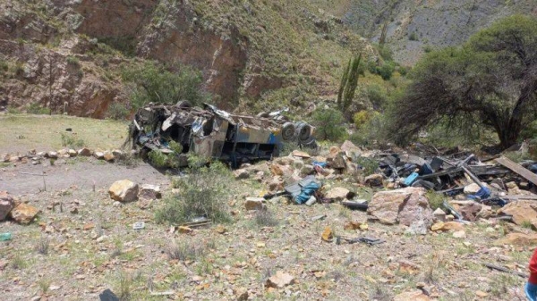 The damaged bus is seen after a deadly crash that killed more than 30 people in Yocalla, Bolivia