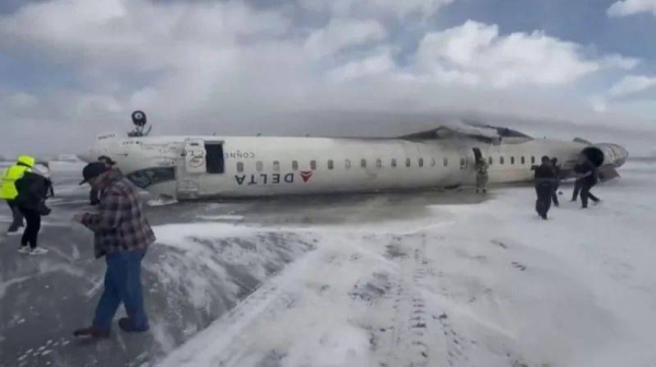 The damaged plane seen on runway at Toronto Pearson Airport