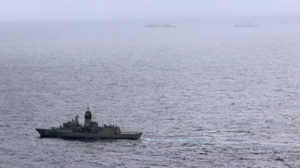 HMAS Arunta, left, shadows the People's Liberation Army-Navy Jiangkai-class frigate Hengyang and a Fuchi-class replenishment vessel