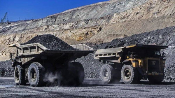 Lorries carry ore from an a mine in central Ukraine