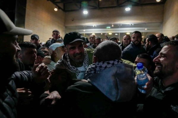 Palestinians are greeted after being released from Israeli prison in the West Bank city of Ramallah on February 27, 2025