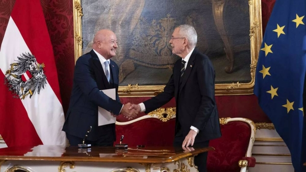 Austrian President Alexander Van der Bellen shakes hands with new Chancellor Christian Stocker at the Hofburg Palace in Vienna, 3 March 2025