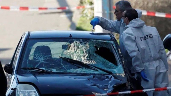 Images from the scene showed police inspecting the car, a small black Ford, which had sustained heavy damage to its front