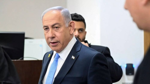 Israeli Prime Minister Benjamin Netanyahu attends his trial on corruption charges at the district court in Tel Aviv, Israel, Wednesday, Feb. 12, 2025. -