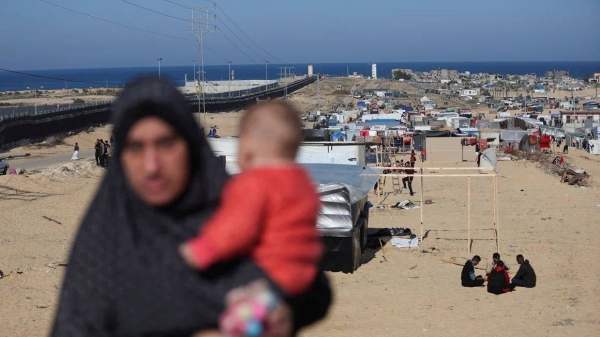 Displaced Palestinians seek shelter near the border with Egypt, in Rafah in the southern Gaza Strip, January 7, 2024