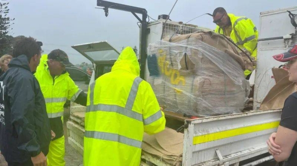 Authorities deliver sandbags to areas on the path of Cyclone Alfred in Queensland