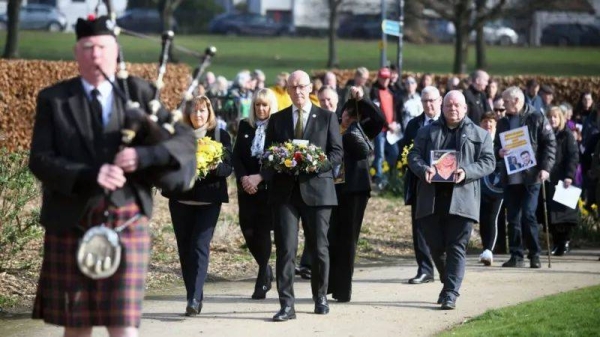 First Minister of Scotland John Swinney laid a wreath during the event at Glasgow Green