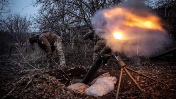 In this photo taken on March 16, 2025 and provided by Ukraine's 24th Mechanized Brigade press service, Ukrainian soldiers fire 120mm mortar towards Russian army positions