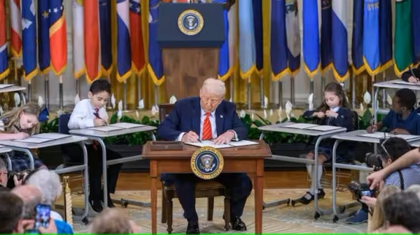 President Donald Trump signed the executive order in the East Room of the White House on March 20 