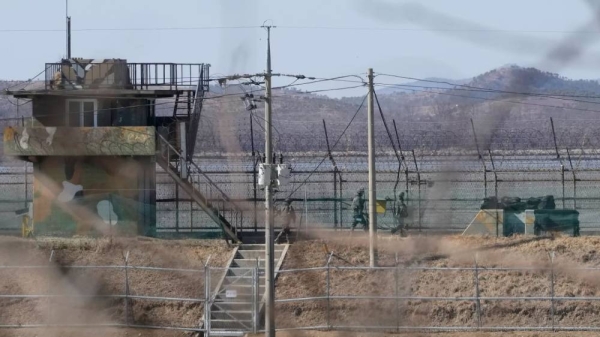 South Korean soldiers patrol the barbed-wire fence in Paju, South Korea, near the border with North Korea on 18 February, 2025