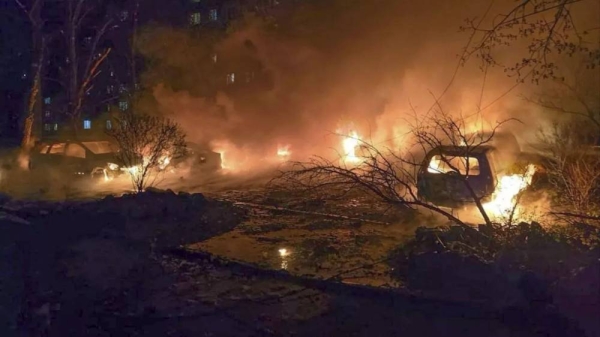 Cars burn following a Russian attack in Dnipro, Ukraine