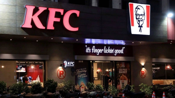 A security guard stands at the entrance of a Kentucky Fried Chicken outlet in Karachi, Pakistan, on April 16, 2025