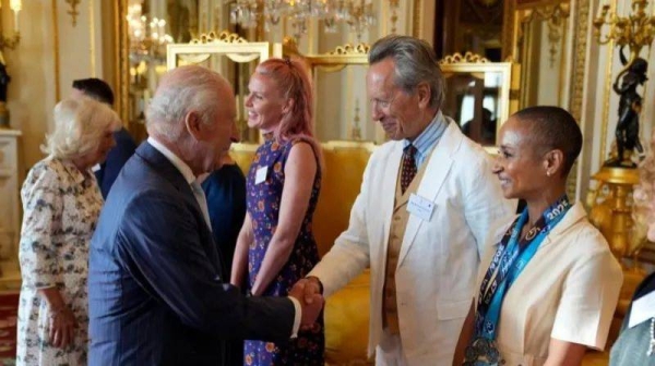 King Charles greeted actor Richard E Grant and radio presenter Adele Roberts during the reception at Buckingham Palace