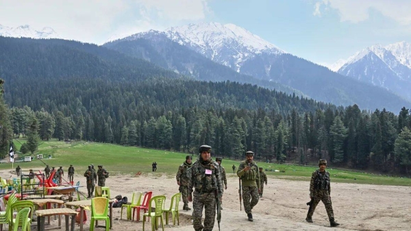 Indian security officers inspect the site in Pahalgam where militants opened fire on tourists in Pahalgam in Indian-controlled Kashmir, on Wednesday, April 23, 2025