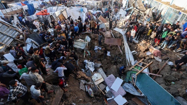 People search for survivors in the aftermath of an Israeli strike on a school compound in central Gaza on May 6, 2025