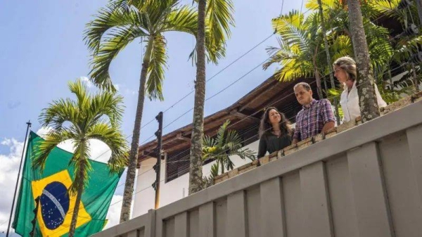 Claudia Macero (L), Pedro Uchurrurtu (C) and Magalli Meda are photographed greeting the media in August from the embassy where they had been sheltering