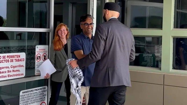 Badar Khan Suri, centre, was released from a Texas detention centre on Wednesday