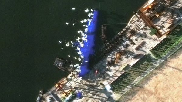This satellite image shows North Korea’s newly launched destroyer lying on its side at Chongjin on May 25, 2025