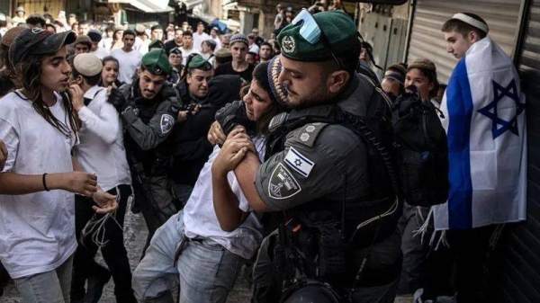 Israeli police remove a right-wing activist in Jerusalem's Old City