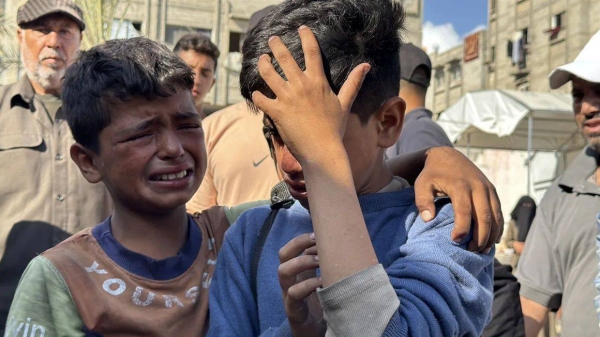The relatives of Palestinians who lost their lives after Israeli forces opened fire on a crowd gathered at an aid distribution point in Khan Younis, Gaza, on Tuesday