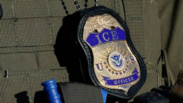 An Immigration and Customs Enforcement agent stands near an immigrant detention center in Elizabeth, New Jersey, on May 7, 2025