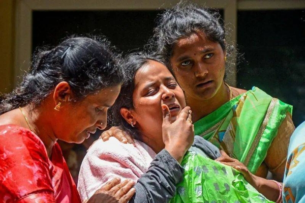 Family members mourn a victim of the crush in Bengaluru