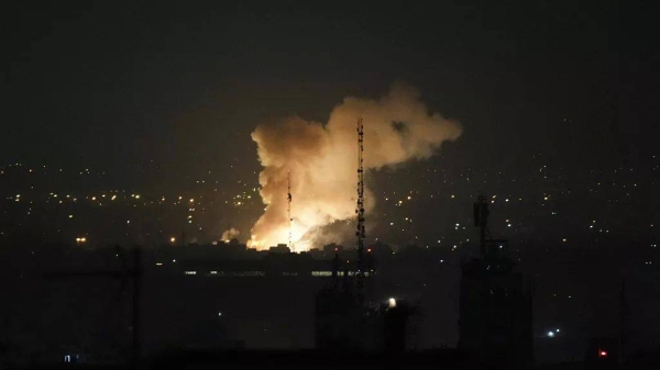 Smoke rises up after an explosion in Tehran, Iran, Friday, June 13, 2025